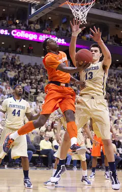 Syracuse forward Jerami Grant's layup attempt is contested by Pitt's Steven Adams (13) at the Petersen Events Center on Saturday. Pitt defeated the Orange 65-55 in the Big East matchup. Grant finished with 5 points and five rebounds on 1-8 shooting. 
