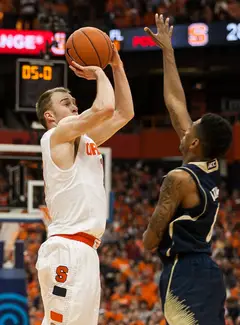 Cooney elevates to shoot over Fighting Irish guard Eric Atkins. Cooney tied an SU program record with nine made 3-pointers.