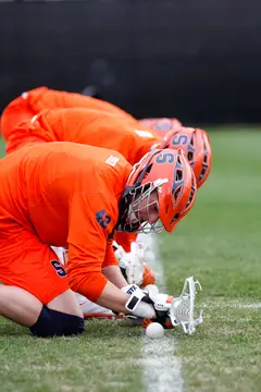 Syracuse faceoff specialists warmup prior to the Orange's game against Duke on Saturday, a rematch of last year's national championship game. 