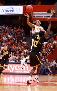 Syracuse guard Ron Patterson releases a pass over Kennesaw State's Damien Wilson.