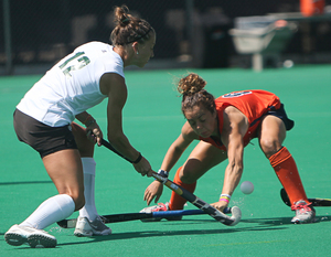 Iona Holloway, a senior Syracuse back, battles for the ball with Cathryn Altdoerffer of Ohio.