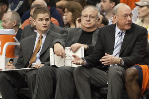 Bernie Fine (center), former associate men’s basketball coach, was fired by the university on Nov. 27, 2011, in light of allegations of child sexual abuse. Stepbrothers Bobby Davis and Mike Lang came forward last year with allegations that Fine molested them as children while they were ball boys at SU.