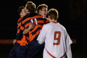 Lars Muller (11) celebrates with teammates following SU's NCAA tournament win in Ithaca, N.Y. Muller scored the decisive goal in the Orange's 1-0 win over Cornell. The Orange will need more of the same to beat No. 14 Virginia Commonwealth on Sunday night.