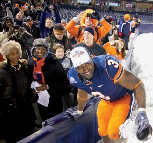 Delone Carter celebrates with fans after Syracuse won the Pinstripe Bowl in 2010. The Orange returns to the bowl game in Yankee Stadium on Dec. 29.