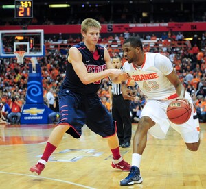 Syracuse forward James Southerland drives to the basket past Detroit's Evan Bruinsma in the Orange's 72-68 win over the Titans on Monday in the Carrier Dome. Southerland hit five 3-pointers in the first half, and finished the game with 22 points. 