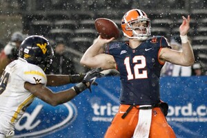Syracuse quarterback Ryan Nassib attempts a pass in the Orange's 38-14 win over West Virginia in the Pinstripe Bowl on Saturday at Yankee Stadium. The game was Syracuse's last as a member of the Big East. 