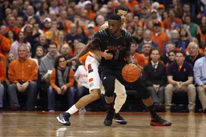 Cincinnati guard Cashmere Wright attempts to gain separation from Syracuse point guard Michael Carter-Williams. Wright missed a potential game-winning 3 in the waning seconds of the Orange's 57-55 win over the Bearcats.