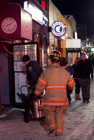 Firefighters respond to an alarm activation at Chipotle  Mexican Grill on Marshall Street on Wednesday night.