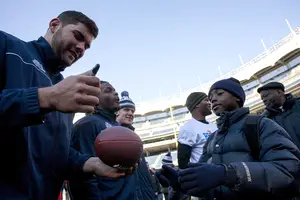 Justin Pugh signs an autograph in Yankee Stadium on Dec. 28 at an event prior to the Pinstripe Bowl. Pugh declared for the NFL Draft Thursday, foregoing his final season of eligibility.