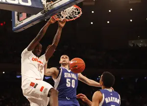 Baye Moussa Keita dunks in Syracuse's win over 75-63 Seton Hall Wednesday in the second round of the Big East tournament. The Orange will face No. 4-seed Pittsburgh Thursday at 2 p.m. in Madison Square Garden.