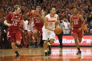 Tyler Ennis scoops a pass to C.J. Fair in No. 1 Syracuse's 56-55 win over N.C. State on Saturday night. Fair collected the pass and scored the game's winning layup with 6.7 seconds on the clock. 