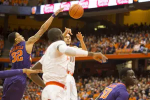Tyler Ennis enters the ball into the post in No. 1 Syracuse's 57-44 win over Clemson on Saturday. Ennis was not his spectacular self, but the Orange didn't need his production with its arsenal of options. 