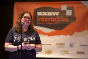 Sarah Roche, co-founder of Platypus TV, defends her team's startup company in the final round of 'Student Startup Madness' at South by South West in Austin, Texas.