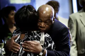 John Lewis, a U.S. representative from Georgia, embraces Margarette B. Nelson in Atlanta at a conference where families of victims lost to Civil Rights era murders converged. The conference, held in 2010, was the first time the families met in one place.