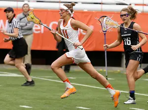 Senior midfielder Amy Cross and her sister Kelly have always been competitive, and are excelling for the nation's top-ranked team this season. 