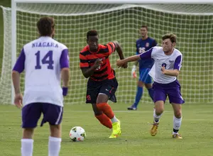 Tyler Hilliard dribbles the ball out of defense in Syracuse's 3-0 win against Niagara Friday. Hilliar featured in a three-man back line with Louis Cross and Jordan Murrell.