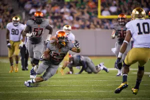 Running back Prince-Tyson Gulley carries the ball against the UND defense. Gulley and the rest of SU's running game fell short against the Irish, ranked one of the best run defenses in the nation.