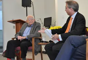 Harry Rosenfeld (Left) and Roy Gutterman (Right) talk in the I-3 Center in Newhouse III on Tuesday. Rosenfeld was an editor at the Washington Post who worked with Woodward and Bernstein during the Watergate scandal.
