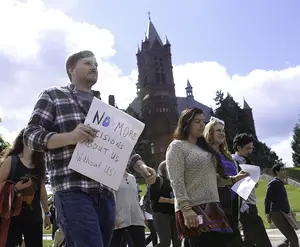Jason Markins, a graduate student in the composition and cultural rhetoric studies program, marched with other protesters to the chancellor’s office on Wednesday. Markins held a sign that said, 