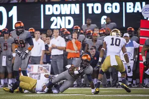 Ervin Philips gets tackled on the left side of the field. Syracuse's quick screens and slants were badly outmatched by Notre Dame's Saturday.