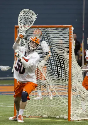 After starting 33 games for Syracuse from 2012–14, Dominic Lamolinara’s aspirations to have a coaching career are now underway as he mentors SU’s goalies in anticipation of the spring season.