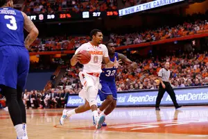 Michael Gbinije dribbles by Dionte Adams in the first half of Syracuse's 65-47 win over Hampton Sunday in the Carrier Dome. Gbinije struggled as a replacement for Kaleb Joseph at point guard.