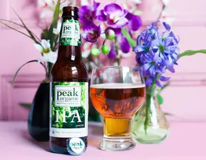 Peak Organic Brewing Company IPA features citrus and floral hops for a bitter, yet smooth taste. The beer is 7.1 percent alcohol, and contains a distinct grassy aftertaste.