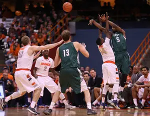 Kaleb Joseph pressures Eric Laster in Syracuse's 70-37 win over Loyola on Tuesday night in the Carrier Dome.