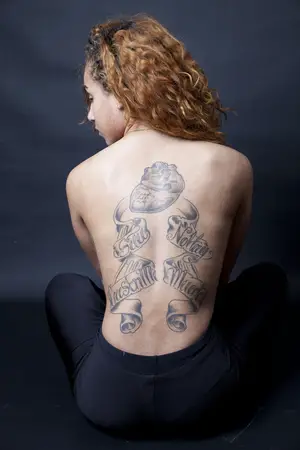 Shantelle Cuevas remembers her grandfather with a tattoo of DNA strands reading “Si Tu Crees En Mi, No Hay Muerte,” which means  “If you believe in me, there is no death.”