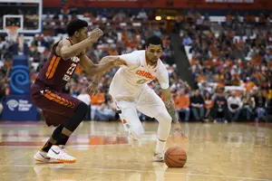 Michael Gbinije drives to the hoop against VT on Tuesday. He sank the game-winning shot from the left block with 0.1 seconds remaining.