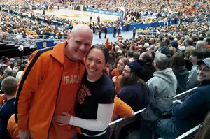 (From left) Jason Tabor and Emily DeSantis got engaged last Saturday at the men's basketball game against Pittsburgh. Tabor proposed to DeSantis in front of about 30,000 people through the kiss cam.