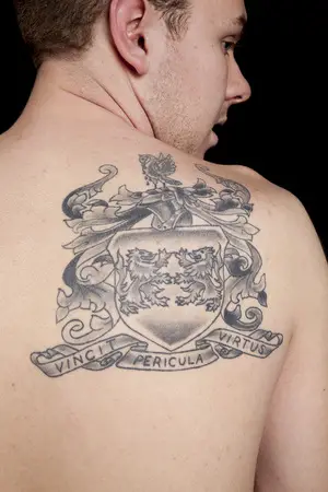 Daniel Collins got a tattoo based on his family’s coat of arms to honor his Irish heritage. The Latin words “vincit pericula virtus” translate to “virtue conquers danger.”      