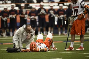 Ben Williams lays on the turf after injuring himself at the beginning of the fourth quarter on Sunday. John Desko expects his faceoff man to be back this week, but also praised Williams' backups.