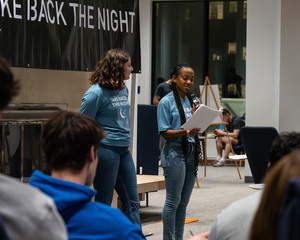 This year's Take Back the Night event is kicked off with opening remarks. Unlike in previous years, the event is held in the Panasci Lounge and the third floor of Schine Student Center.
