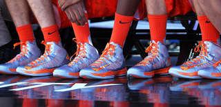 The orange camouflage shoes of the Syracuse Orange are seen during the game against the San Diego State Aztecs during the Battle on the Midway game on Sunday.