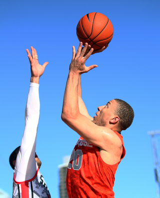 Brandon Triche of the Syracuse Orange shoots the ball against the San Diego State Aztecs during the Battle on the Midway game on Sunday.