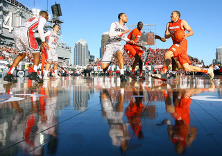 Brandon Triche of the Syracuse Orange drives to the basket against the San Diego State Aztecs during the Battle on the Midway game on Sunday.