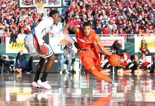 Michael Carter-Williams of the Syracuse Orange drives the ball down the court against the San Diego State Aztecs during the Battle on the Midway game on Sunday.