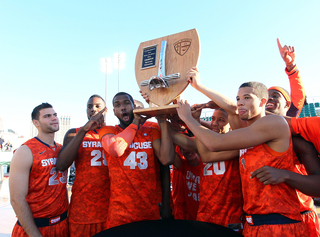 The Syracuse Orange receives its trophy after the win over the San Diego State Aztecs during the Battle on the Midway game on Sunday.
