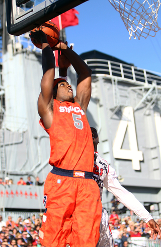 C.J. Fair of the Syracuse Orange dunks the ball against the San Diego State Aztecs during the Battle on the Midway game on Sunday.