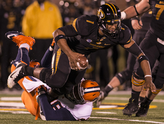 Missouri quarterback James Franklin is taken down by Syracuse defensive tackle Jay Bromley.