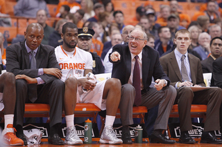 Jim Boeheim points out directions to his team from the bench.