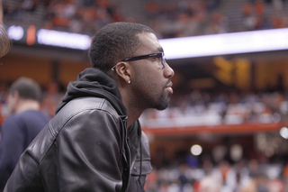 Former Syracuse basketball player Donte Greene watches from the crowd during SU's win over Eastern Michigan.