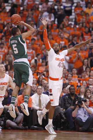 James Southerland leaps in an attempt to block a shot from Eastern Michigan guard Derek Thompson.