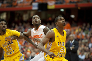 Rakeem Christmas jockeys for a position against two Alcorn State players.
