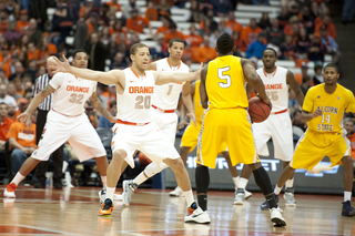 Syracuse sets up its defense as Alcorn State guard Marquiz Baker holds the ball.
