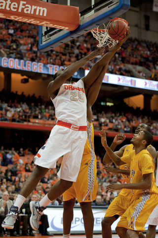Rakeem Christmas leaps over onlooking Alcorn State defenders to attempt a layup.