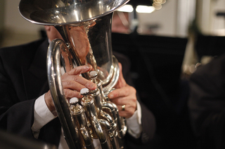 The Syracuse Brass Ensemble is considered to be an American brass ensemble due to its variety of brass instruments. Most brass bands, which are predominately British, use instruments from one brass family. 