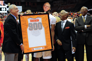 Jim Boeheim and athletic director Daryl Gross laugh during a postgame celebration.