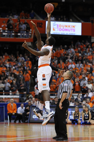 Syracuse forward Rakeem Christmas fights for the opening tip in the Orange's 72-68 win over Detroit on Monday in the Carrier Dome. Syracuse's win gave head coach Jim Boeheim his 900th career victory.